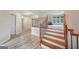View of the staircase with modern railing and a glimpse into a spacious carpeted room at 1979 Alcovy Shoals Blf, Lawrenceville, GA 30045