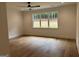 Bright bedroom featuring a large window with hardwood flooring at 555 Discovery Lake Dr, Fayetteville, GA 30215