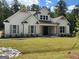 Charming single-Gathering home featuring a symmetrical facade, stone accents and well-manicured front lawn at 555 Discovery Lake Dr, Fayetteville, GA 30215