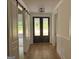 Hallway featuring hardwood floors, double doors leading to the outside, and slider to the left at 555 Discovery Lake Dr, Fayetteville, GA 30215