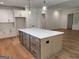 Kitchen island featuring drawers, cabinet space, and pendant lighting above at 555 Discovery Lake Dr, Fayetteville, GA 30215