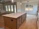 Spacious kitchen island with seating, hardwood floors, and pendant lights at 555 Discovery Lake Dr, Fayetteville, GA 30215