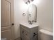 Stylish bathroom with a modern vanity, arched mirror, and elegant fixtures at 5582 Rockingwood Ct, Atlanta, GA 30349