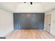 Bedroom boasts a feature wall, tray ceiling, and ample natural light at 5582 Rockingwood Ct, Atlanta, GA 30349