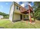 Back exterior of home, featuring a deck, yard, and walkout basement at 5582 Rockingwood Ct, Atlanta, GA 30349