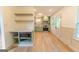 Modern kitchen with sage green cabinets, stainless appliances, and light hardwood floors at 5582 Rockingwood Ct, Atlanta, GA 30349