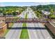 Peachtree City aerial view showing overhead pedestrian bridge above a busy roadway at 310 Westbourne Dr, Tyrone, GA 30290