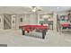 Spacious basement with a pool table, mini bar, and basketball arcade game at 310 Westbourne Dr, Tyrone, GA 30290