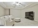 Comfortable basement living room with plush seating, perfect for movie nights and relaxation at 310 Westbourne Dr, Tyrone, GA 30290