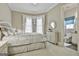 Inviting bedroom featuring plush carpet, two windows dressed with elegant curtains, and a comfortable bed with white linens at 310 Westbourne Dr, Tyrone, GA 30290
