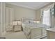 Cozy bedroom features neutral walls, plush carpeting, a full-size bed, and a matching nightstand at 310 Westbourne Dr, Tyrone, GA 30290