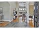 Spacious foyer featuring a high ceiling, beautiful hardwood floors and stone tile at 310 Westbourne Dr, Tyrone, GA 30290