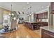 Open kitchen with large island, granite countertops, stainless appliances and eat in area at 310 Westbourne Dr, Tyrone, GA 30290