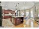 Kitchen boasts a large island, granite countertops, stainless appliances and eat in area at 310 Westbourne Dr, Tyrone, GA 30290