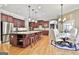 Open kitchen with large island, granite countertops, stainless appliances and eat in area at 310 Westbourne Dr, Tyrone, GA 30290