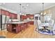 Gourmet kitchen with a large island, stainless steel appliances, custom cabinetry, and an adjoining breakfast area at 310 Westbourne Dr, Tyrone, GA 30290