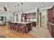 Kitchen boasts a large island with seating, granite countertops, and stainless steel appliances at 310 Westbourne Dr, Tyrone, GA 30290