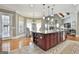 Open concept kitchen and breakfast nook with updated appliances, island seating, and great natural light at 310 Westbourne Dr, Tyrone, GA 30290