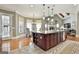 Kitchen boasts large island with seating, granite countertops and stainless appliances at 310 Westbourne Dr, Tyrone, GA 30290