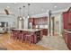 The kitchen features a large island with bar seating, custom cabinetry, and stainless steel appliances at 310 Westbourne Dr, Tyrone, GA 30290