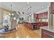 Open-concept kitchen featuring a large center island with bar seating and stainless steel appliances at 310 Westbourne Dr, Tyrone, GA 30290