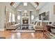 Inviting living room with a stone fireplace, hardwood floors, and vaulted ceiling with exposed beams at 310 Westbourne Dr, Tyrone, GA 30290