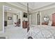 Comfortable main bedroom showcasing a plush bed and access to a home office space at 310 Westbourne Dr, Tyrone, GA 30290
