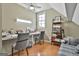 Bright office with desk, ceiling fan, and a well-lit shelf with assorted items at 310 Westbourne Dr, Tyrone, GA 30290
