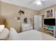 Comfortable bedroom includes a dresser, television and shelf at 1466 Lake Forest Ln, Mcdonough, GA 30253