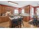 Well-lit kitchen with an island, quartz countertops, tile backsplash and stainless appliances at 1466 Lake Forest Ln, Mcdonough, GA 30253