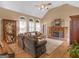 Spacious living room with fireplace, hardwood floors, vaulted ceilings and arched windows at 1466 Lake Forest Ln, Mcdonough, GA 30253