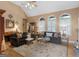 Cozy living room with hardwood floors, vaulted ceilings, fireplace and comfortable seating at 1466 Lake Forest Ln, Mcdonough, GA 30253