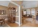 Open-concept living room visible from the dining room, featuring hardwood floors and vaulted ceilings at 1466 Lake Forest Ln, Mcdonough, GA 30253