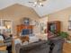 Comfortable living room featuring a fireplace, vaulted ceiling and hardwood floors at 1466 Lake Forest Ln, Mcdonough, GA 30253