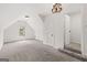 Finished attic space with carpet, chandelier and dormer window at 7020 Grand View Way, Suwanee, GA 30024
