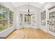 Bright breakfast nook with hardwood floors, lots of windows and access to a patio at 7020 Grand View Way, Suwanee, GA 30024