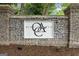 Stone entrance to Olde Atlanta Club with manicured landscaping, providing a welcoming first impression at 7020 Grand View Way, Suwanee, GA 30024