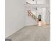 Open entryway with staircase, hardwood floors and bright natural light at 7020 Grand View Way, Suwanee, GA 30024