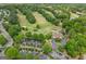 Aerial view of the golf course and clubhouse, showcasing the lush greenery and manicured grounds at 7020 Grand View Way, Suwanee, GA 30024