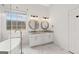 Well-lit main bathroom with a soaking tub, dual vanities, and modern lighting fixtures at 7020 Grand View Way, Suwanee, GA 30024