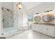 Elegant main bathroom with a soaking tub, glass shower, dual vanities, and marble tile at 7020 Grand View Way, Suwanee, GA 30024