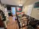 Open dining area with access to the kitchen and a fenced-off space for pets at 177 Villa Rosa Way, Temple, GA 30179