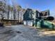 Exterior of house with two garage doors, carport and landscaped yard at 177 Villa Rosa Way, Temple, GA 30179