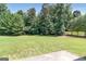 Well-maintained backyard with a lush lawn and mature trees at 3183 Jackson Creek Dr, Stockbridge, GA 30281
