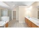 Bathroom with double vanity, soaking tub, glass shower, tile floor and large mirror at 3183 Jackson Creek Dr, Stockbridge, GA 30281