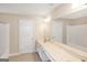 Bathroom with a double vanity and a large mirror at 3183 Jackson Creek Dr, Stockbridge, GA 30281