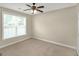 Neutral bedroom with carpet, ceiling fan, and a bright window at 3183 Jackson Creek Dr, Stockbridge, GA 30281