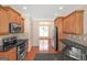 Well-lit kitchen with stainless steel appliances, wooden cabinets, and hardwood floors at 3183 Jackson Creek Dr, Stockbridge, GA 30281