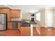 Open kitchen view featuring a bar, stainless steel appliances, and modern design at 3183 Jackson Creek Dr, Stockbridge, GA 30281