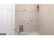 Laundry room featuring utility sink, washer/dryer hookups, shelving and door to adjacent room at 3183 Jackson Creek Dr, Stockbridge, GA 30281